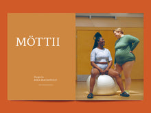 Load image into Gallery viewer, Magazine spread, left side reads text "MÖTTII", right side features photo of two ladies on yoga ball wearing stretch sport tops and shorts
