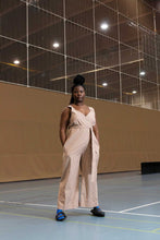 Load image into Gallery viewer, Lady in sportshall wearing a cross over jumpsuit style overalls
