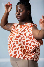 Load image into Gallery viewer, Lady has hands up in movement, wearing an open sleeve loose style top