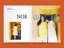 Load image into Gallery viewer, Two-page magazine spread, features images of models wearing sleeveless dresses, alongside the text "Noe".