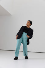 Load image into Gallery viewer, Model wears a jacket and trousers with inverted pleat details