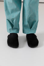 Load image into Gallery viewer, Close up of model wearing trousers with inverted pleat detail at hem