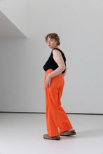 Load image into Gallery viewer, Model wears straight legged trousers with strappy vest top