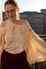 Load image into Gallery viewer, Lady wears a top with cut out details at each shoulder