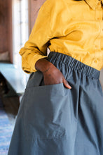 Load image into Gallery viewer, Close up shot of large patch pocket on skirt sewn on at an angle.