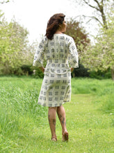 Load image into Gallery viewer, Back view of model wearing Jumpset Dress with tie-belt at waist