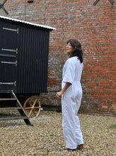 Load image into Gallery viewer, Side view of model wearing Jumpset trouser Jumpsuit, 3/4 length sleeves