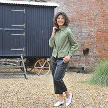 Load image into Gallery viewer, Model wears a long-sleeve, collared blouse with pleats at shoulder seams