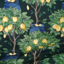 Load image into Gallery viewer, Cotton Lawn fabric with a pattern of lemon trees with lemons; fabric displayed with drape
