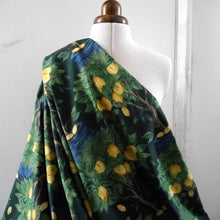 Load image into Gallery viewer, Cotton Lawn fabric with a pattern of lemon trees, displayed draped on mannequin