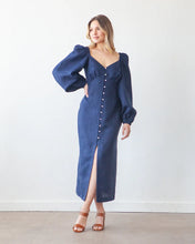 Load image into Gallery viewer, Model wears a button front dress with empire bust seam, and V neck line, with long puff sleeves