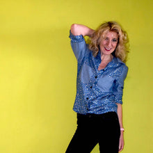 Load image into Gallery viewer, Lady wears the Anna Shirt made in 2 different fabrics. The sleeves, collar and pockets in one plain fabric, the body of the shirt in a printed fabric.
