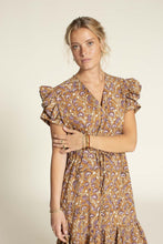 Load image into Gallery viewer, Close up of model bodice, wearing an Abby Dress View B: a V-neck, with ruffles at armhole, and waist tie atop a tiered ruffled skirt