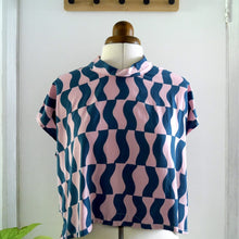 Load image into Gallery viewer, Front view of zero waste tie top on mannequin: a sleeveless cropped top with band neck