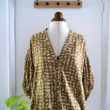 Load image into Gallery viewer, V-Neck Blouse with gathered puff sleeves on mannequin