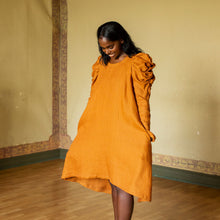Load image into Gallery viewer, Lady wears an A-Line dress with puffed shoulders, long sleeves