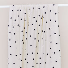 Load image into Gallery viewer, EcoVero Viscose fabric with dots print over a rail