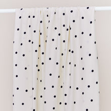 Load image into Gallery viewer, EcoVero Viscose fabric with dots print over a rail
