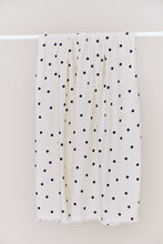 Load image into Gallery viewer, EcoVero Viscose fabric with dots print over a rail
