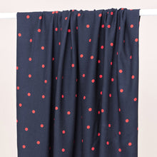 Load image into Gallery viewer, Dot print EcoVero Viscose Crepe fabric hangs over a rail