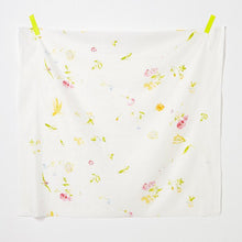 Load image into Gallery viewer, Square of scattered florals pattern design on organic cotton double gauze fabric hangs by tape of top two corners
