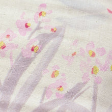 Load image into Gallery viewer, Close up of organic cotton double gauze fabric showing watercolour print of small flowers among long petals