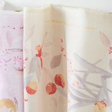 Load image into Gallery viewer, End of bolt against the wall of organic cotton double gauze fabric showing watercolour print of cherry-like fruits in petals