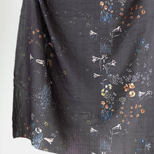 Load image into Gallery viewer, Organic Cotton Double Gauze fabric hangs with drape, showing a watercolour floral print