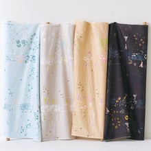 Load image into Gallery viewer, Four fabric bolts slightly rolled out against the wall to display floral print of Organic Cotton Double Gauze fabrics in different colour ways.
