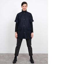 Load image into Gallery viewer, Lady stands wearing the Cap Sleeve Vest over a long sleeved top