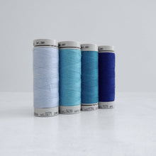 Load image into Gallery viewer, Four reels of Recycled Polyester Sewing Thread in four colours