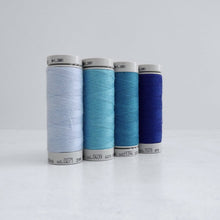 Load image into Gallery viewer, Four reels of Recycled Polyester Sewing Thread in four colours