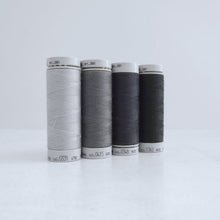 Load image into Gallery viewer, Four reels of Recycled Polyester Sewing Thread in four colours