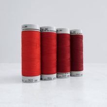 Load image into Gallery viewer, Four reels of Recycled Polyester Sewing Thread in four colours