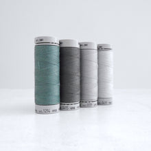 Load image into Gallery viewer, Four reels of Recycled Polyester Sewing Thread in four colours
