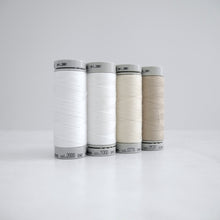 Load image into Gallery viewer, Four reels of Recycled Polyester Sewing Thread in four colours