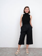 Load image into Gallery viewer, Lady stands wearing culottes, a shortened leg version of the High Waisted Trouser pattern