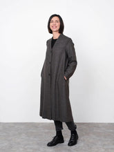 Load image into Gallery viewer, Lady stands wearing V-Neck Coat fastened with 3 buttons down centre front. Hands in inseam side pockets