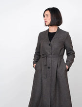 Load image into Gallery viewer, Lady wears V-Neck Coat fastened down centre front with 3 buttons, and a waist tie belt.