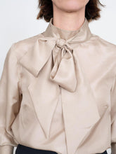 Load image into Gallery viewer, Front view of Blouse with a large bow tie