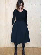 Load image into Gallery viewer, Lady stands wearing a tulip shaped skirt