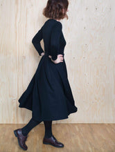 Load image into Gallery viewer, Side view of lady mid-walk wearing tulip shape skirt