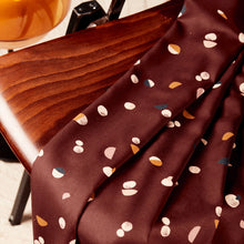 Load image into Gallery viewer, EcoVero Viscose Twill fabric in soft pleats on a wooden chair