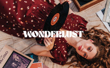 Load image into Gallery viewer, Lady lays on rug holding a vinyl record, wears a pleated dress made from the Fizzy Rust EcoVero Viscose Twill fabric