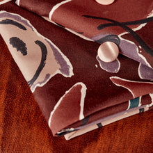 Load image into Gallery viewer, Folded pieces of EcoVero Viscose fabrics with buttons on top