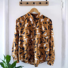 Load image into Gallery viewer, Shirt made with Shadow Ochre Viscose Modal fabric on hanger