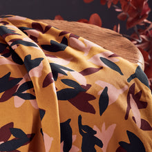 Load image into Gallery viewer, Seraphine Ochre EcoVero Viscose fabric draped over a wooden stool