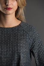 Load image into Gallery viewer, Close up of raglan sleeve seam.