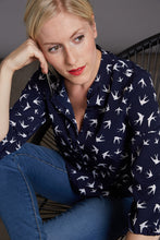 Load image into Gallery viewer, Close up view of lady wearing The Blouse in bird print fabric, sat in chair.
