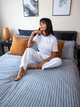 Load image into Gallery viewer, Lady sat on bed wearing The Pyjama Bottoms